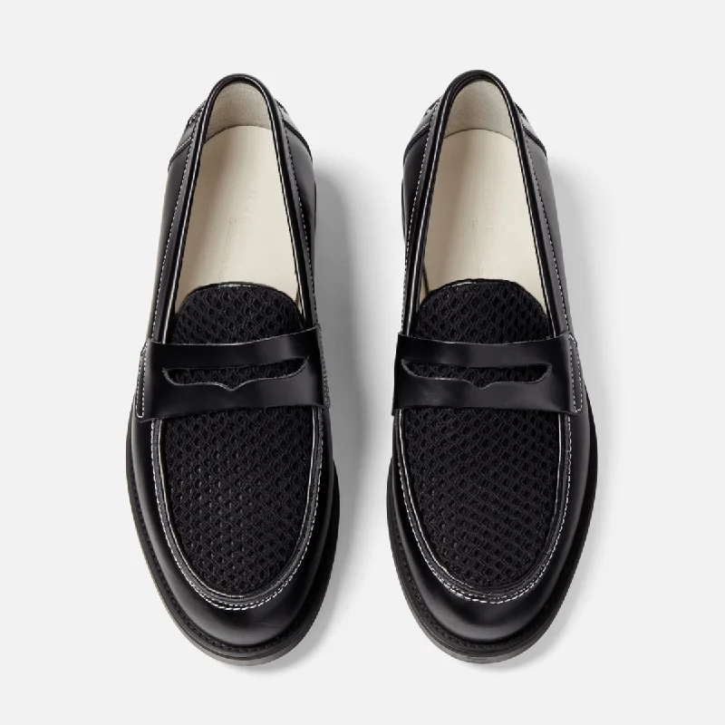 Men's loafers with a stretchy side panel for a better fitWilde Black Rattan Penny Loafer - Men's Men's loafers with a stretchy side panel for a better fitWilde Black Rattan Penny Loafer - Men's